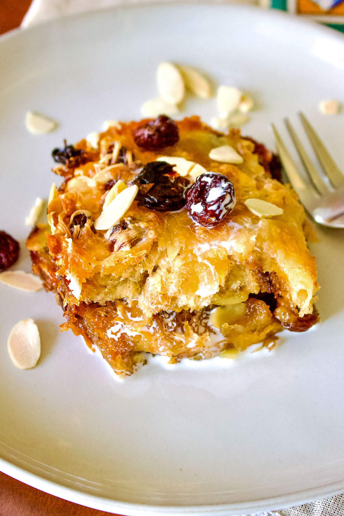Authentic Mexican Capirotada- Bread Pudding is the Mexican version of the so popular bread pudding that you can find in many cuisines. This Capirotada is traditionally eaten during Lent, before Easter but you can also make it all year round. It is good for parties, holidays or Sunday meals in the family. Capirotada on plate with fork