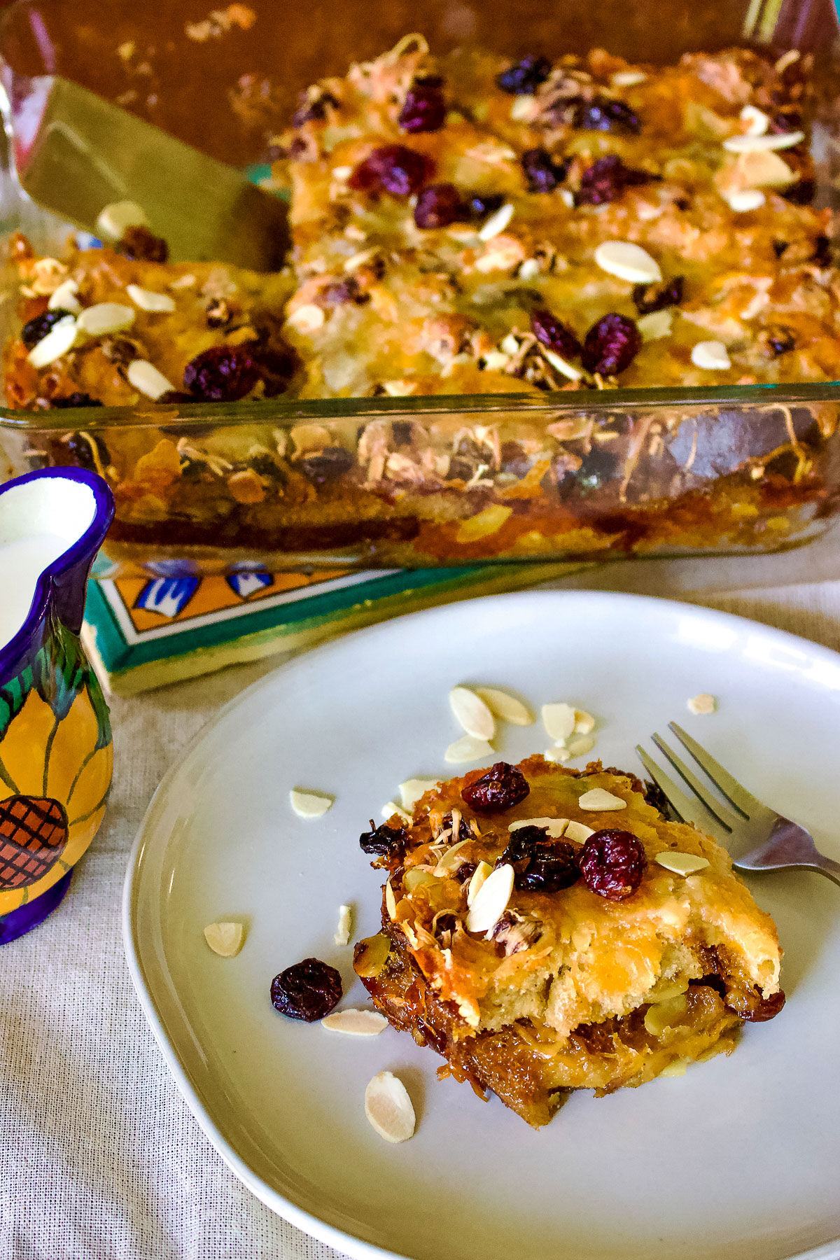Authentic Mexican Capirotada- Bread Pudding is the Mexican version of the so popular bread pudding that you can find in many cuisines. This Capirotada is traditionally eaten during Lent, before Easter but you can also make it all year round. It is good for parties, holidays or Sunday meals in the family. Capirotada slice on plate0