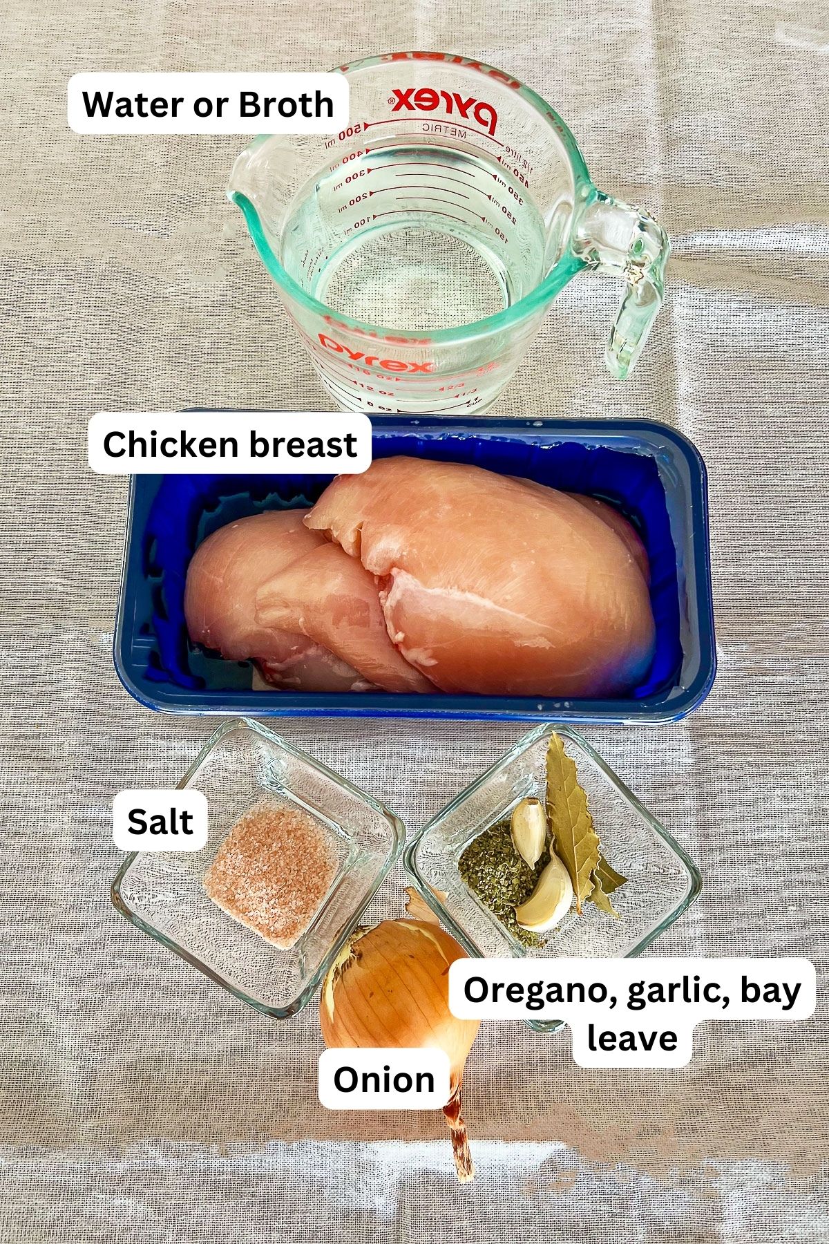 Ingredients to cook chicken breast for tinga.