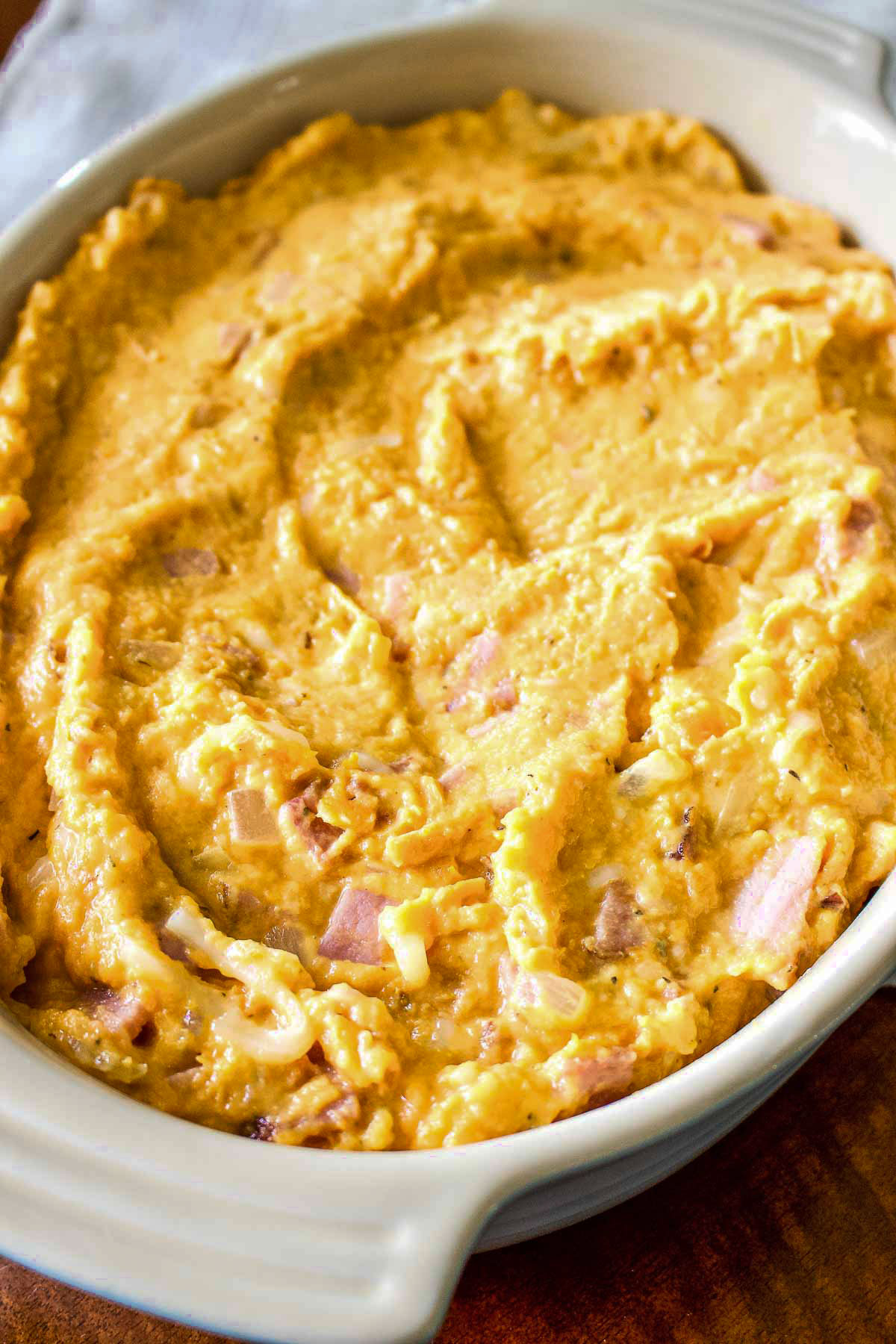 Savory sweet potato casserole ready for baking.
