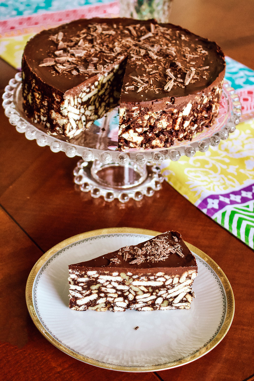 Slice of Biscuit Chocolate Cake with cake behind