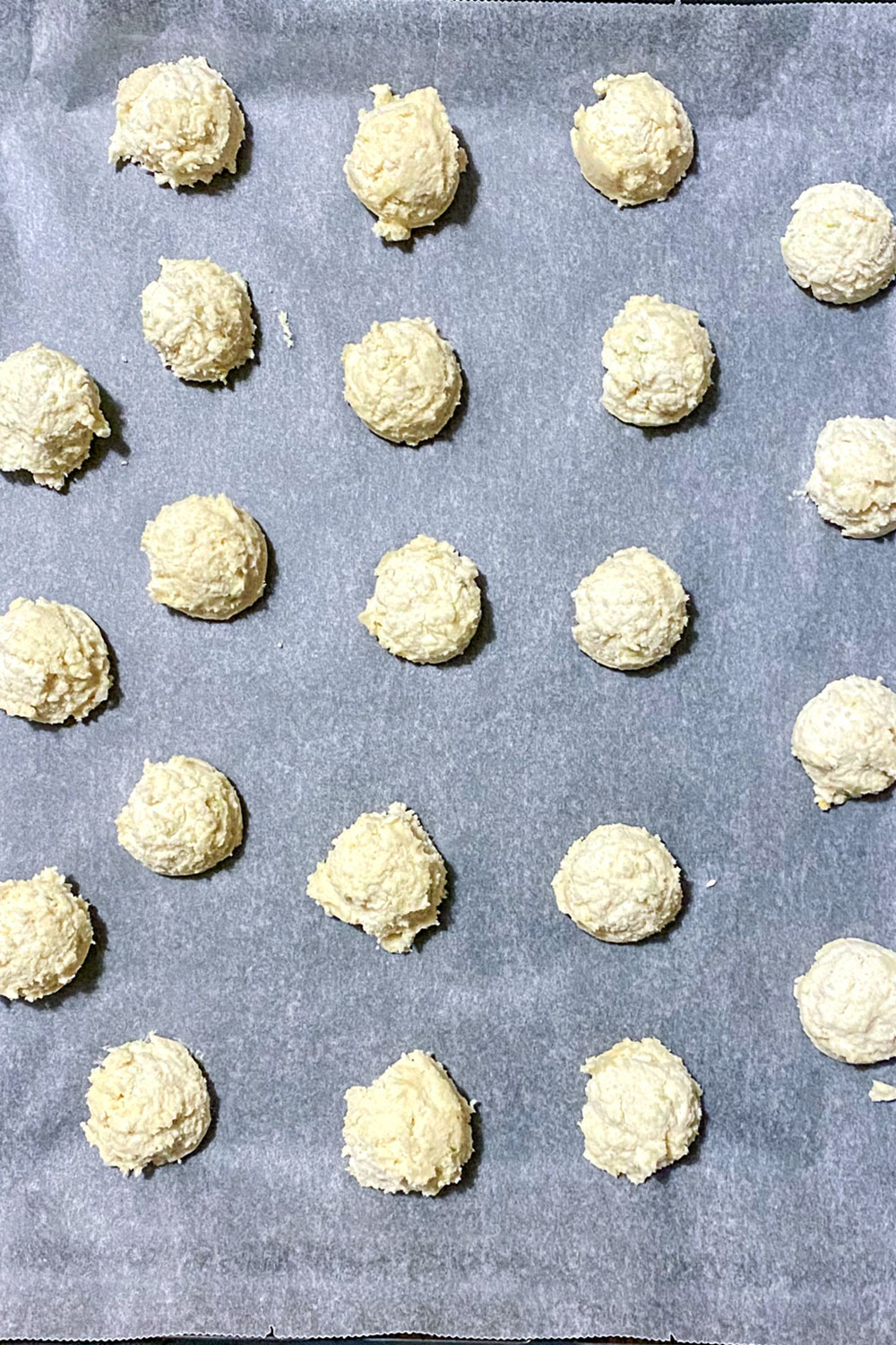 Unbaked lemon cream cheese cookies on tray0