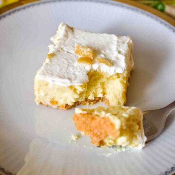 Key Lime Bar on a white plate with fork.