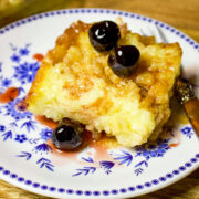 Baked Apple Rice Pudding slice on a blue and white plate.