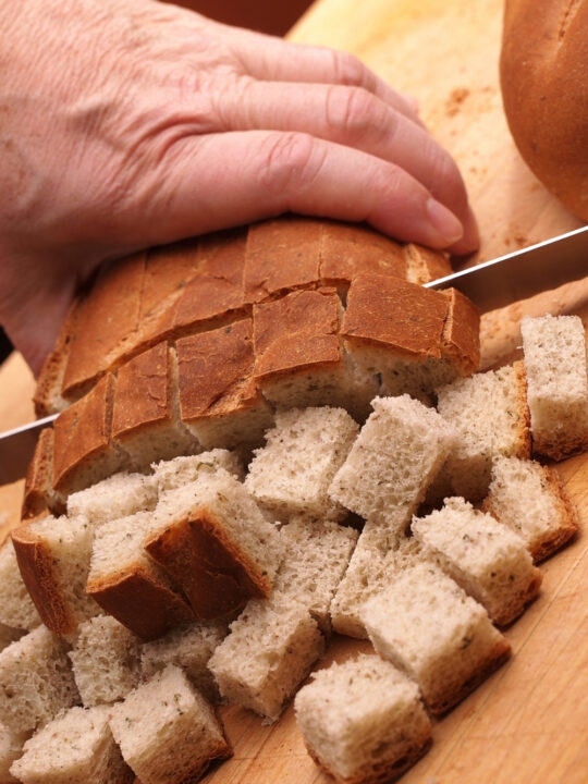 Cubed bread for blueberry savory bread pudding