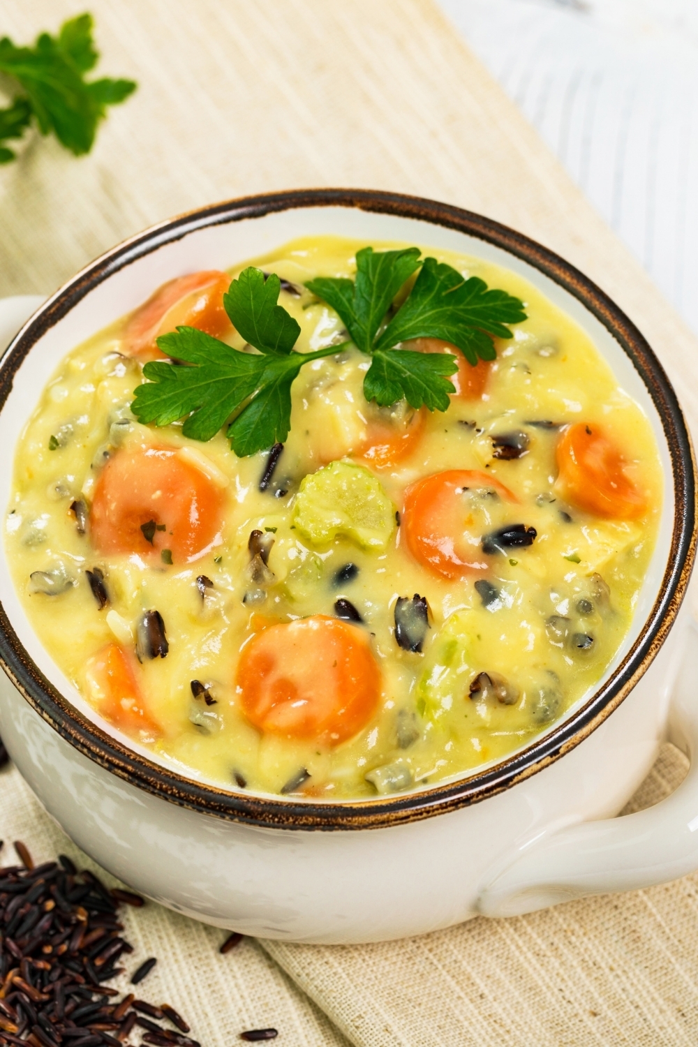 wild rice soup in a white pot