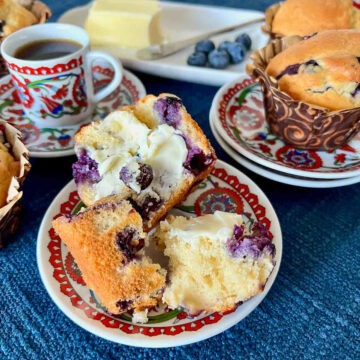 Delicious Classic Blueberry Muffins on plates served with Turkish coffee.