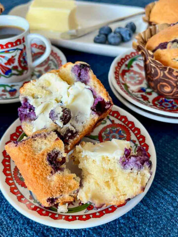 Delicious Classic Blueberry Muffins on plates served with Turkish coffee.