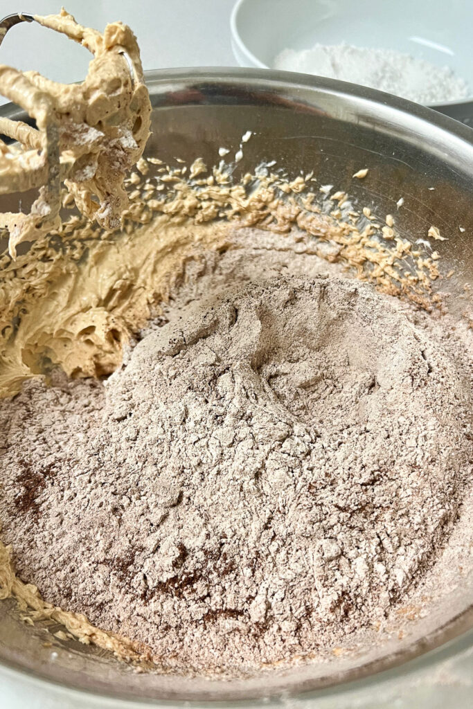Adding flour to the batter0