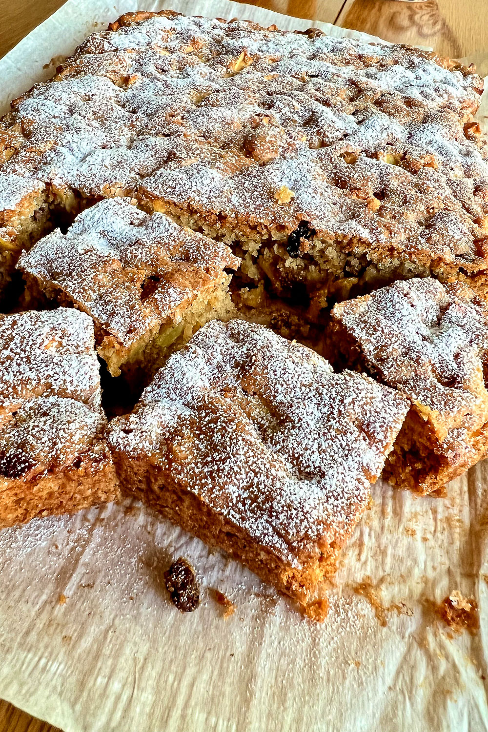 Baked Apple bars on wooden board0
