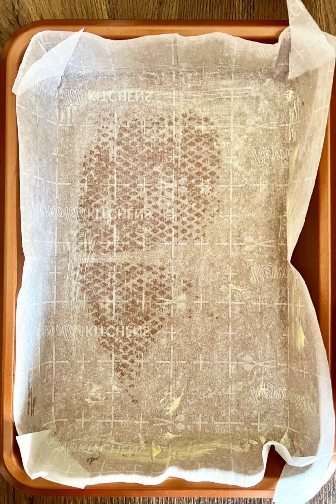 Baking pan covered with parchment paper0