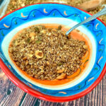 Cooked granola in a colorful bowl square photo0