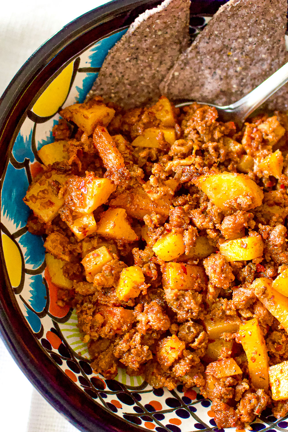 Papas Con Chorizo in a colorful Mexican bowl
Potatoes with Mexican Sausage
