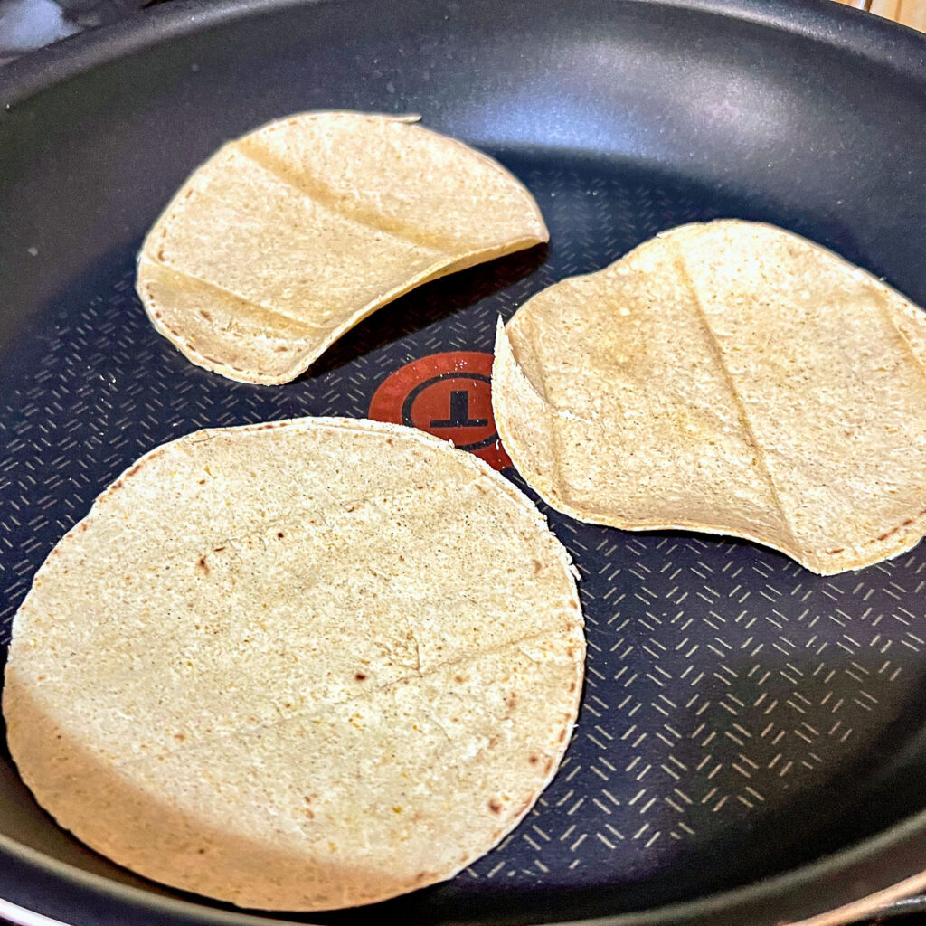 Tortillas heating on the stove