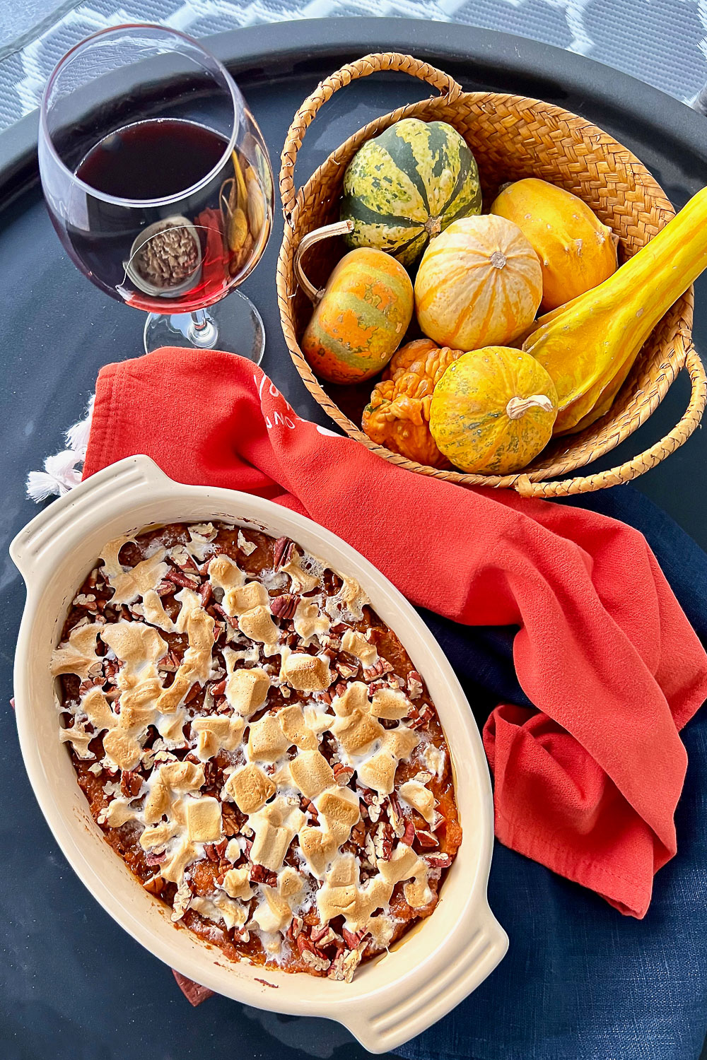 Sweet potato casserole on black table with Fall decorations0