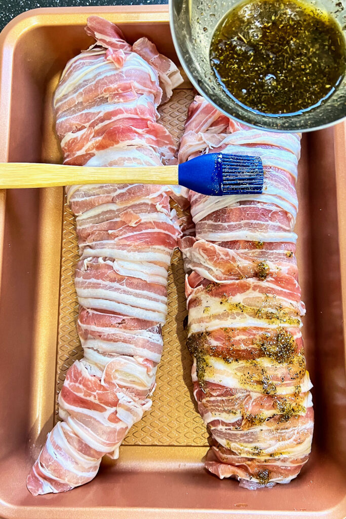 Raw Pork Tenderloin wrapped in bacon glazed with honey and spices0