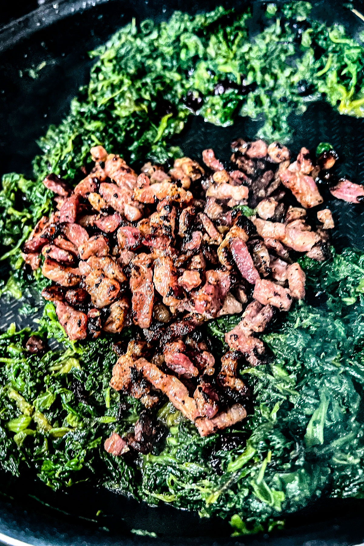 Spinach with bacon cooking in the pan0