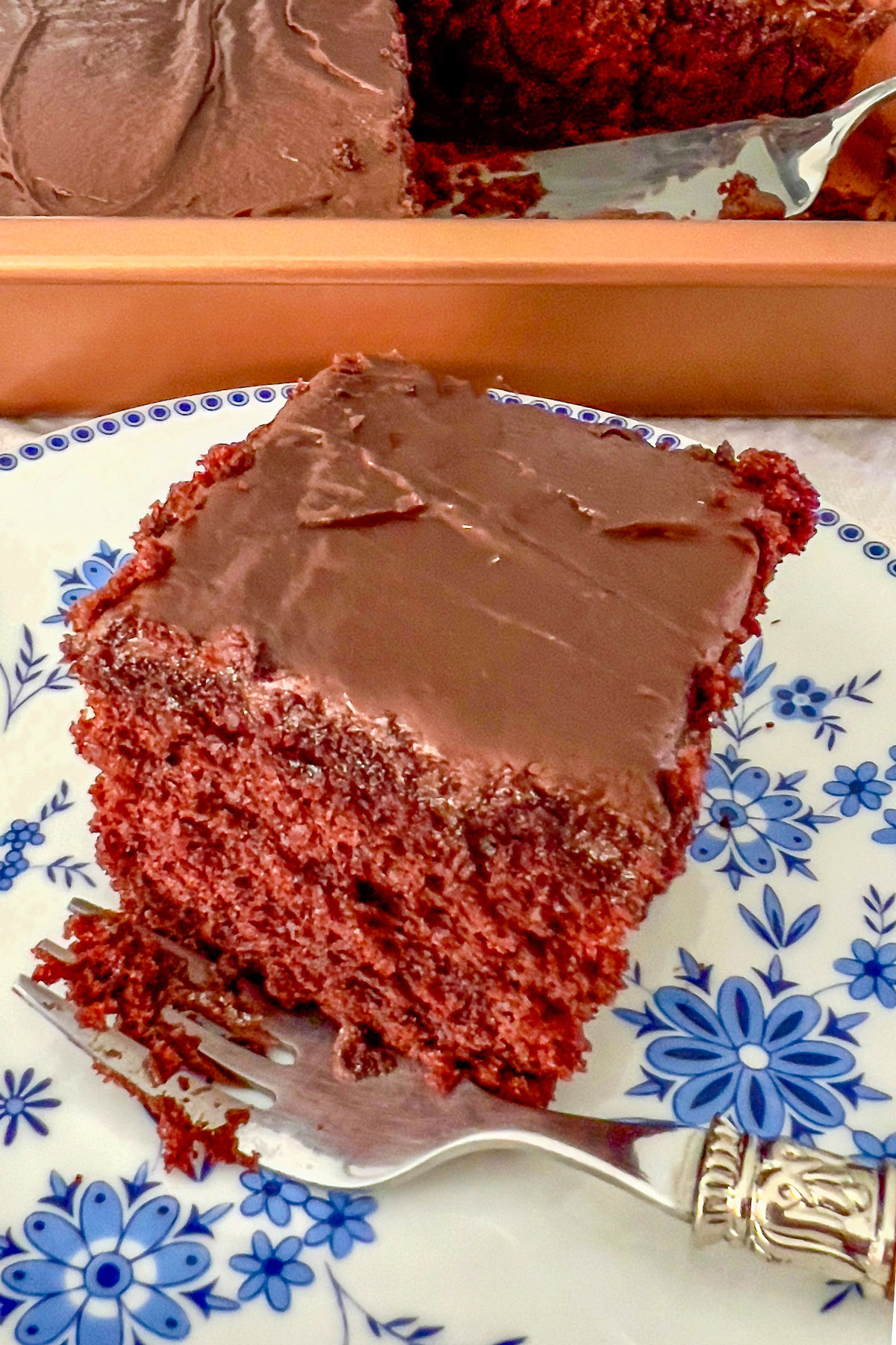 Wacky Cake on a white and blue plate