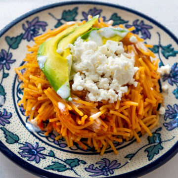 Sopa seca de fideo in a blue and white plate