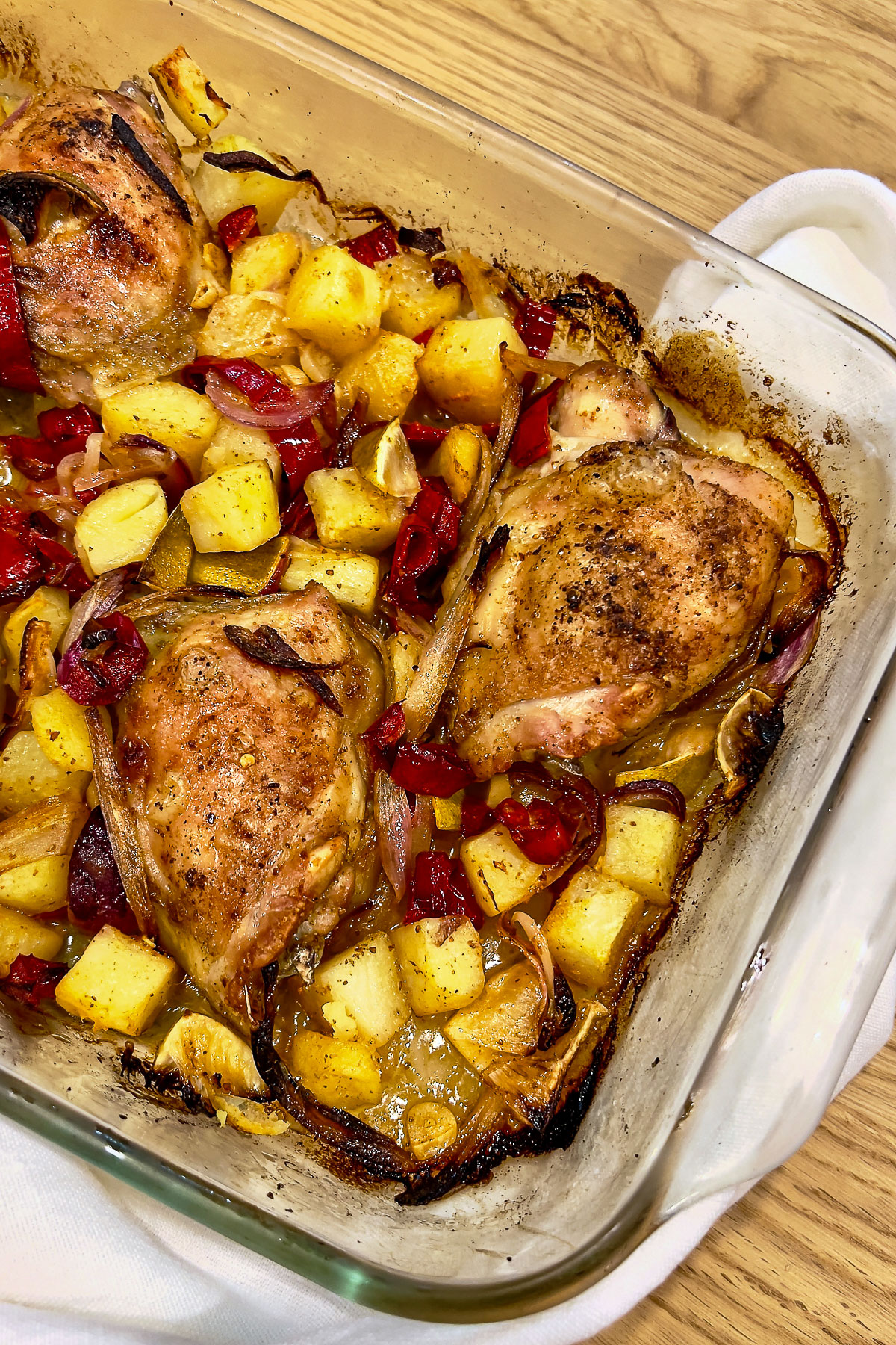 Chicken and potatoes baked in the oven with lime and harissa0