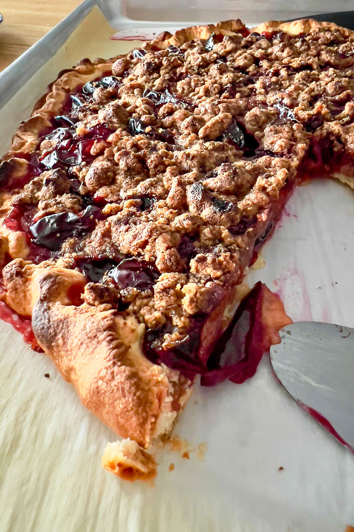 Spiced Plum Crumble Tart on the baking tray