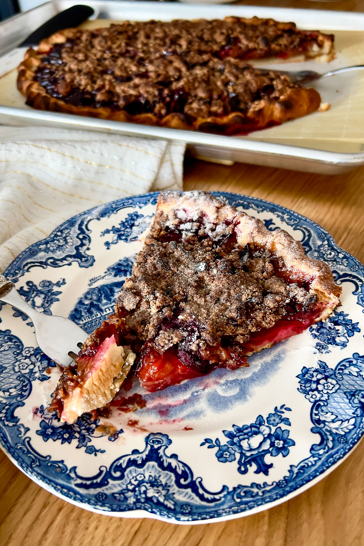 Taking a bite of Spiced Plum Crumble Tart