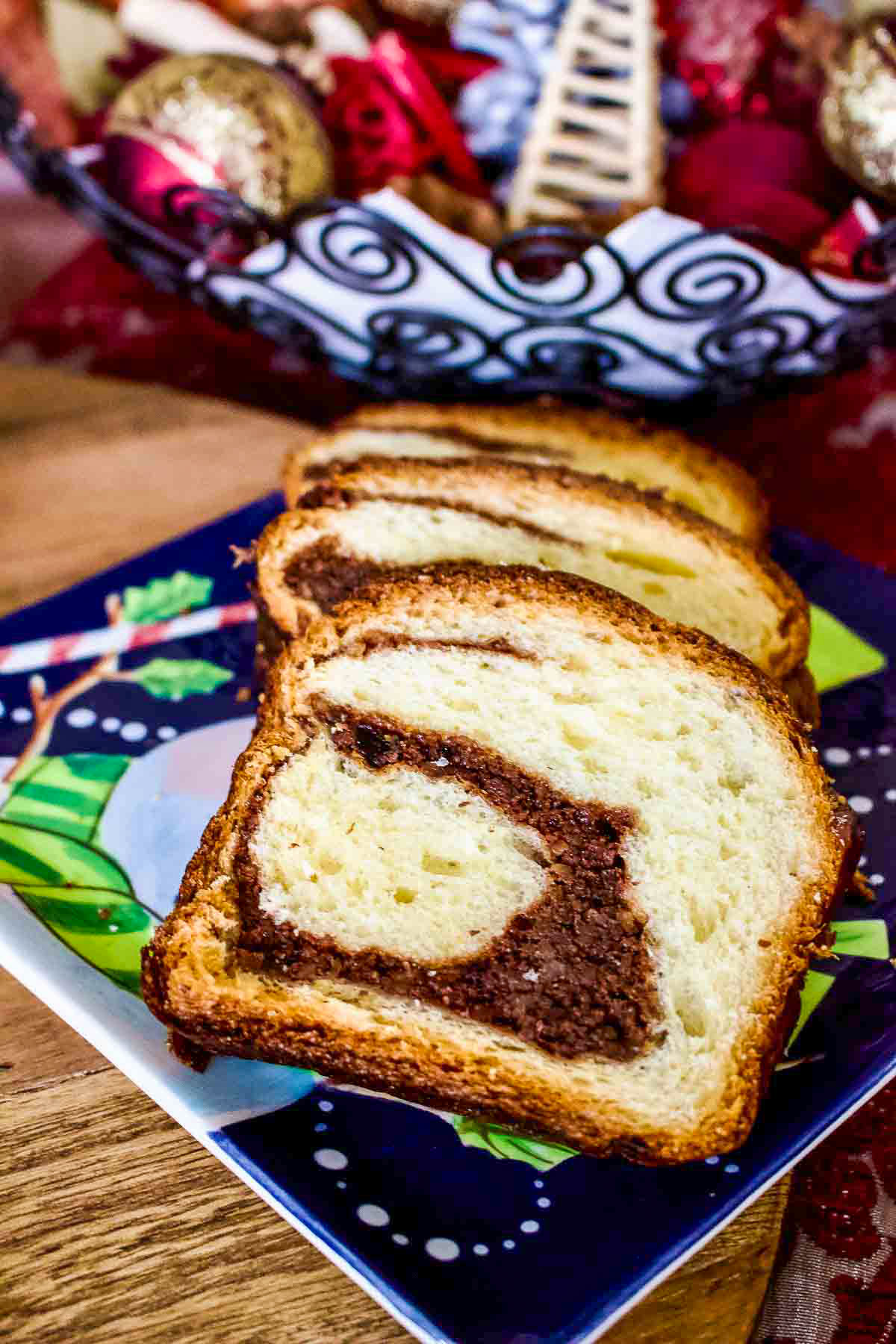 Slices of Romanian Sweet Bread With walnuts on a christmas decorated table.