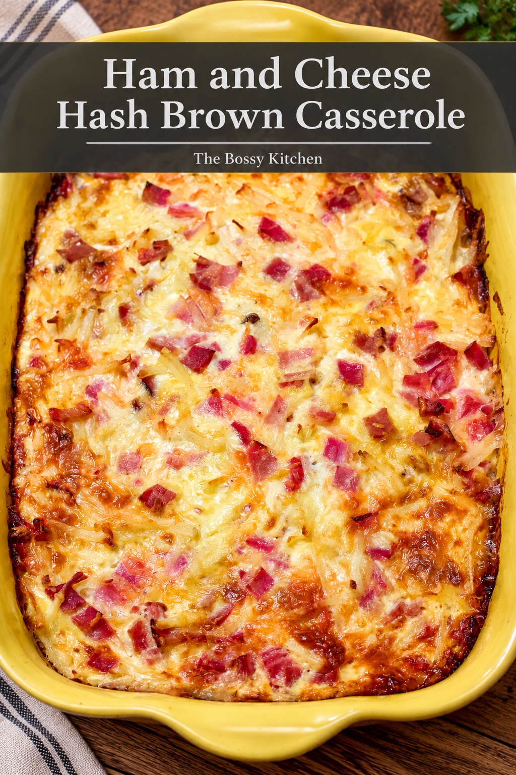 Ham And cheese hash brown casserole baked in a yellow pan.