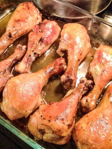 Brandy Vanilla Chicken Legs in a glass baking pan.