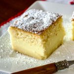 Vanilla Magic Cake slice on white plate.