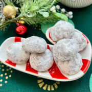 Mexican Wedding Cookies on a Christmas plate.