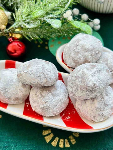 Mexican Wedding Cookies on a Christmas plate.