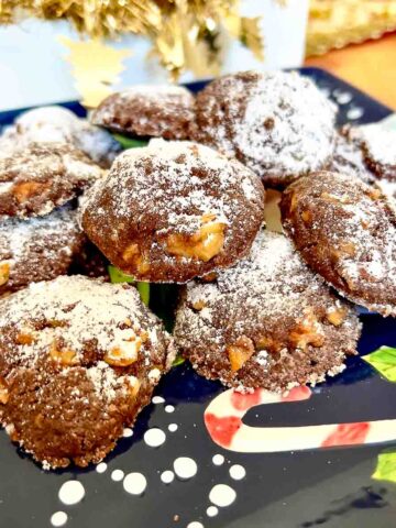Mocha Walnut Butter Cookies on Christmas decorated plate.