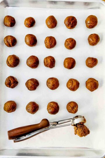 Forming the cookies on a baking tray.