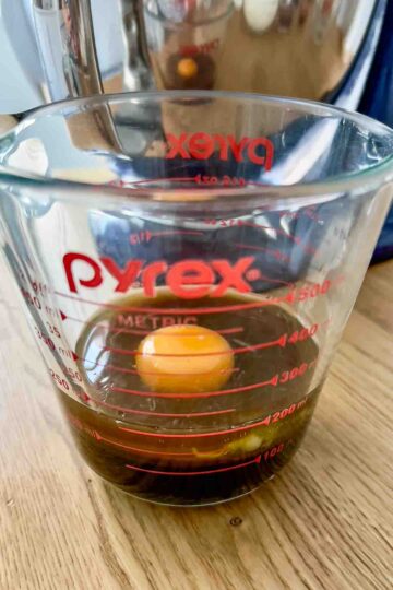 Mixing the molasses with the rest of wet ingredients.