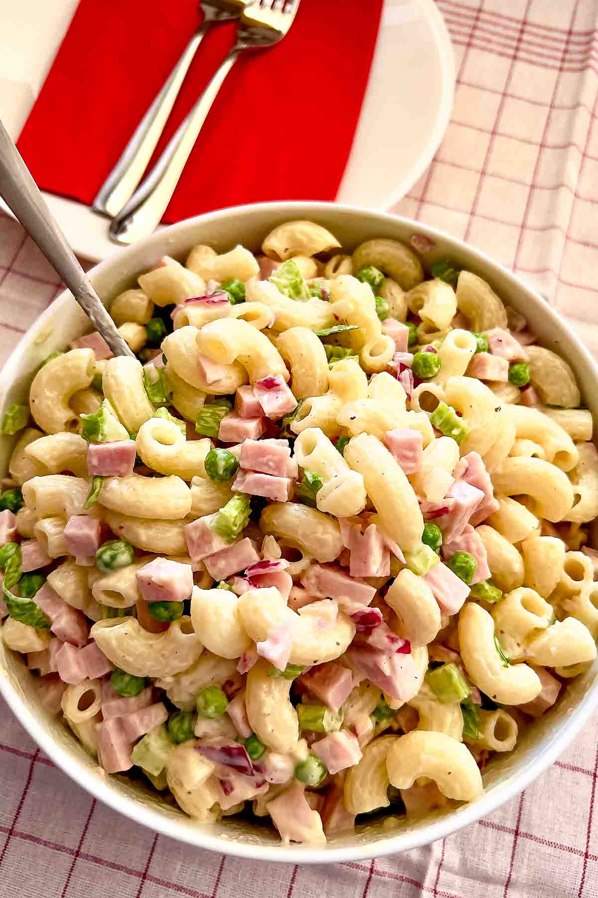 Pasta Salad with Ham and Mayo in a white bowl.