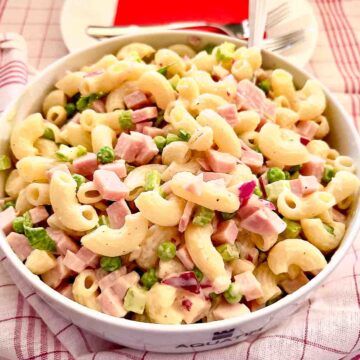 Summer Macaroni Salad With Ham in a white bowl.