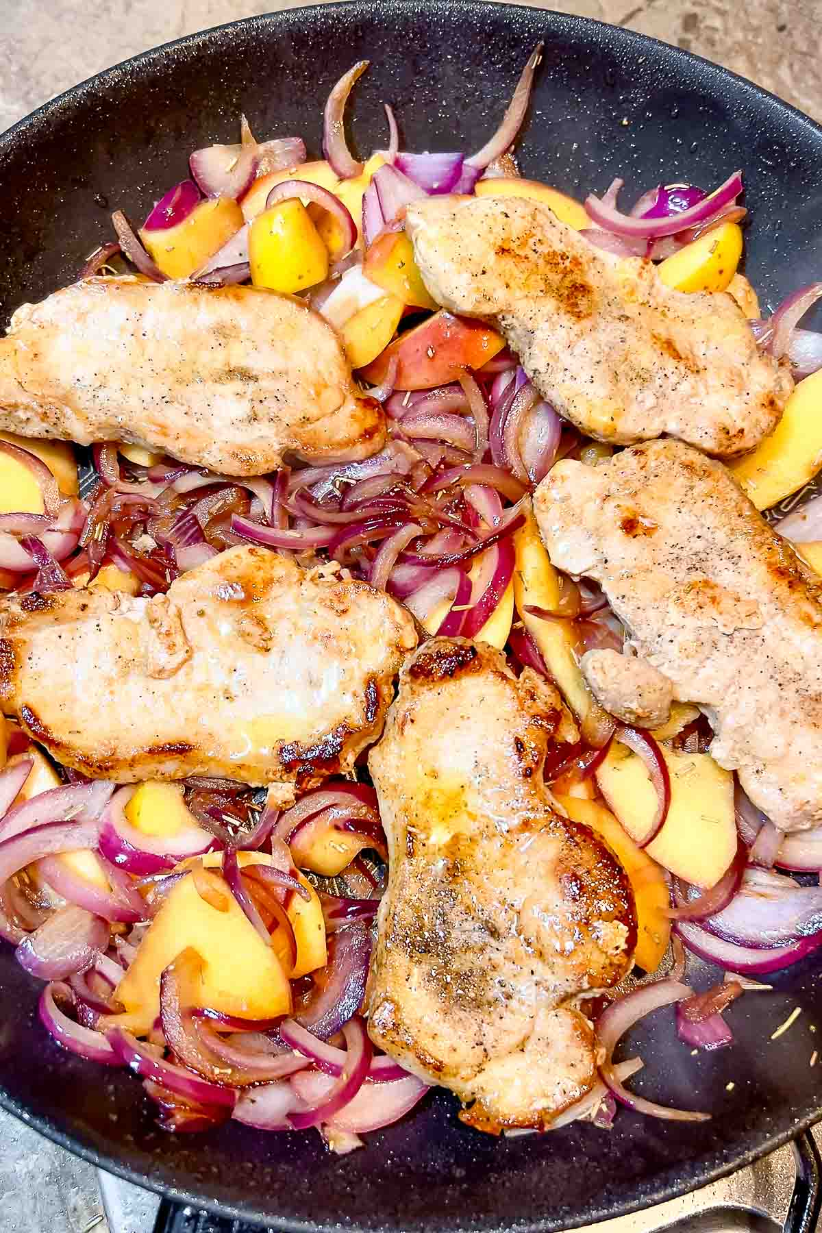Adding pork slices back to the pan.
