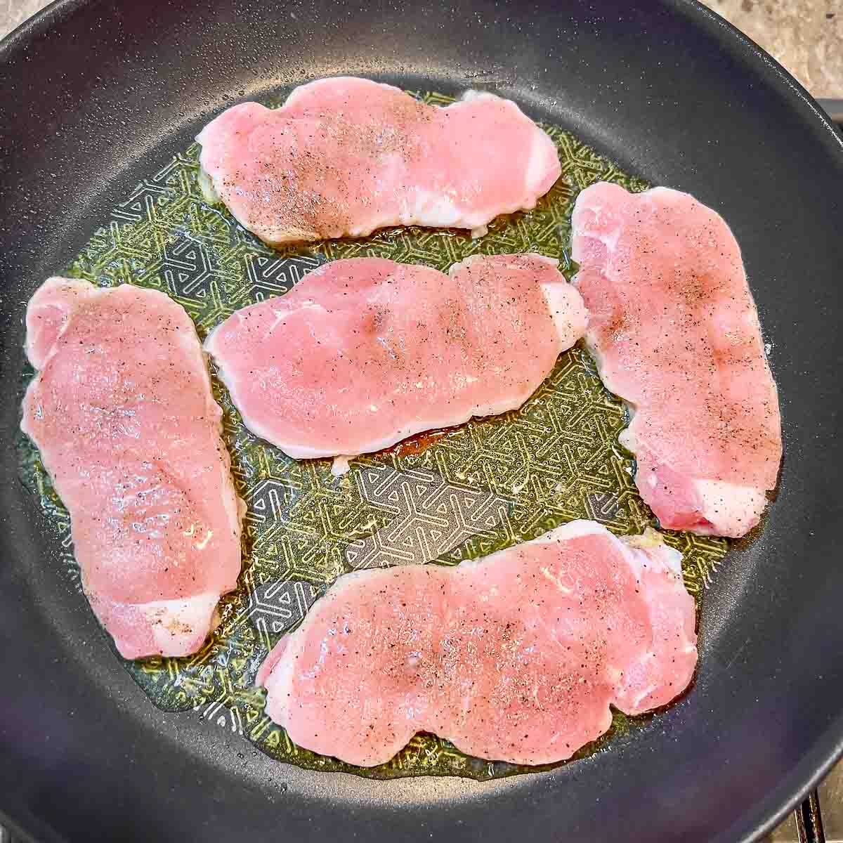 Pork Loin Thin Cuts cooking in the pan.