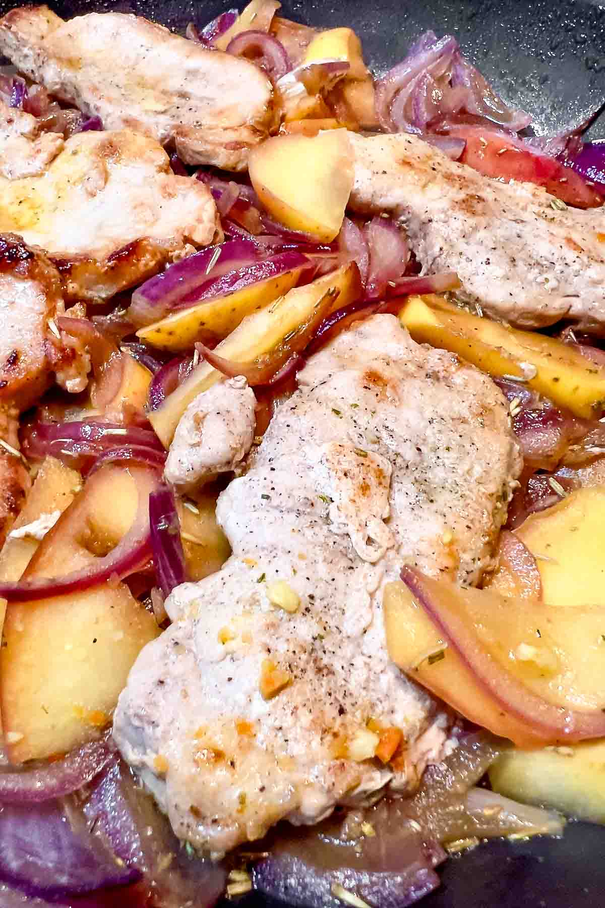Pork Slices With Apples And Onions.