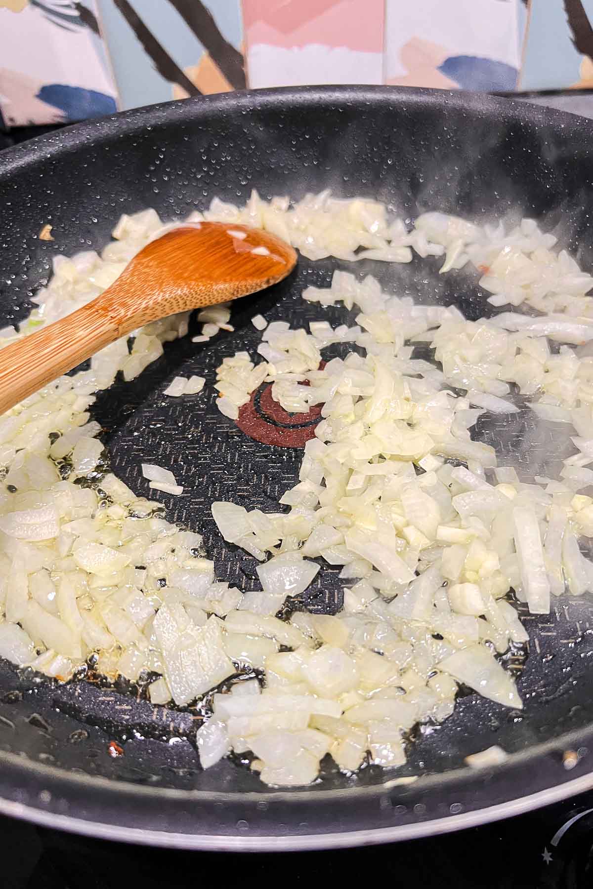 Cooking onions and garlic in a pan.