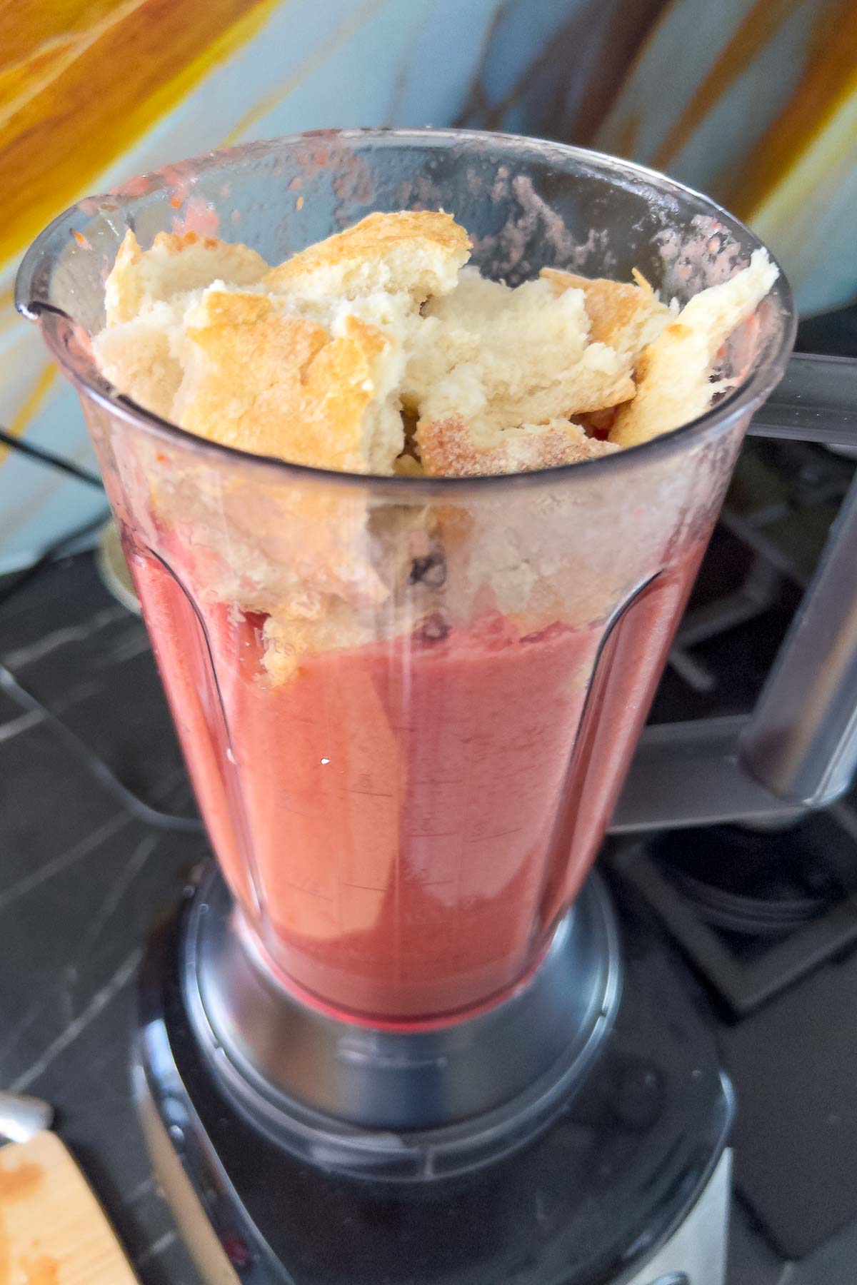 Adding bread to the blender