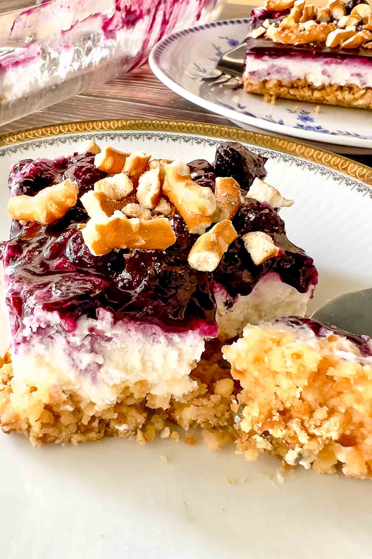 Blueberry Pretzel Salad slice on a plate.