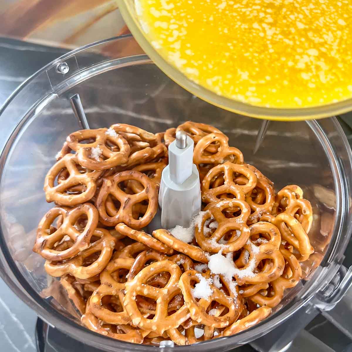 Pretzels, sugar and butter in the food processor for the crust.