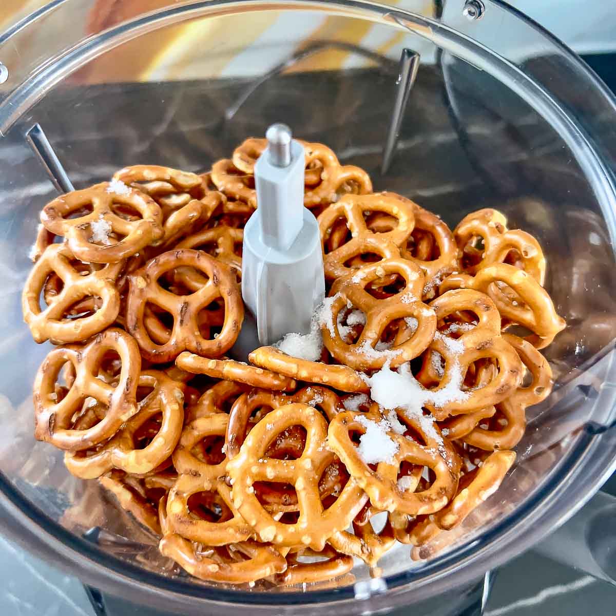 Pretzels and sugar in the food processor.