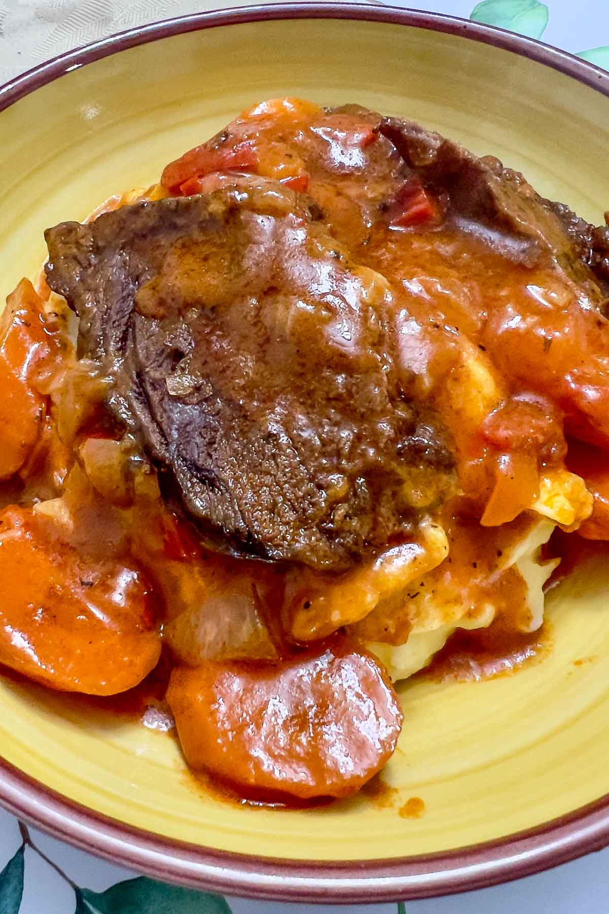Roasted Beef in tomato sauce with mashed potatoes.